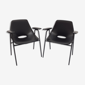 Pair of armchairs, Tonneau model, in black skai by Pierre Guariche, 60s