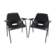 Paire de fauteuils modèle Tonneau, en skaï noir par Pierre Guariche, années 60