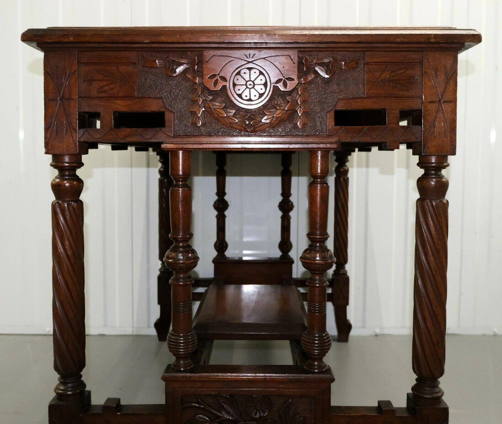 19th-century carved walnut desk with a leather top.