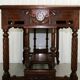 19th-century carved walnut desk with a leather top.