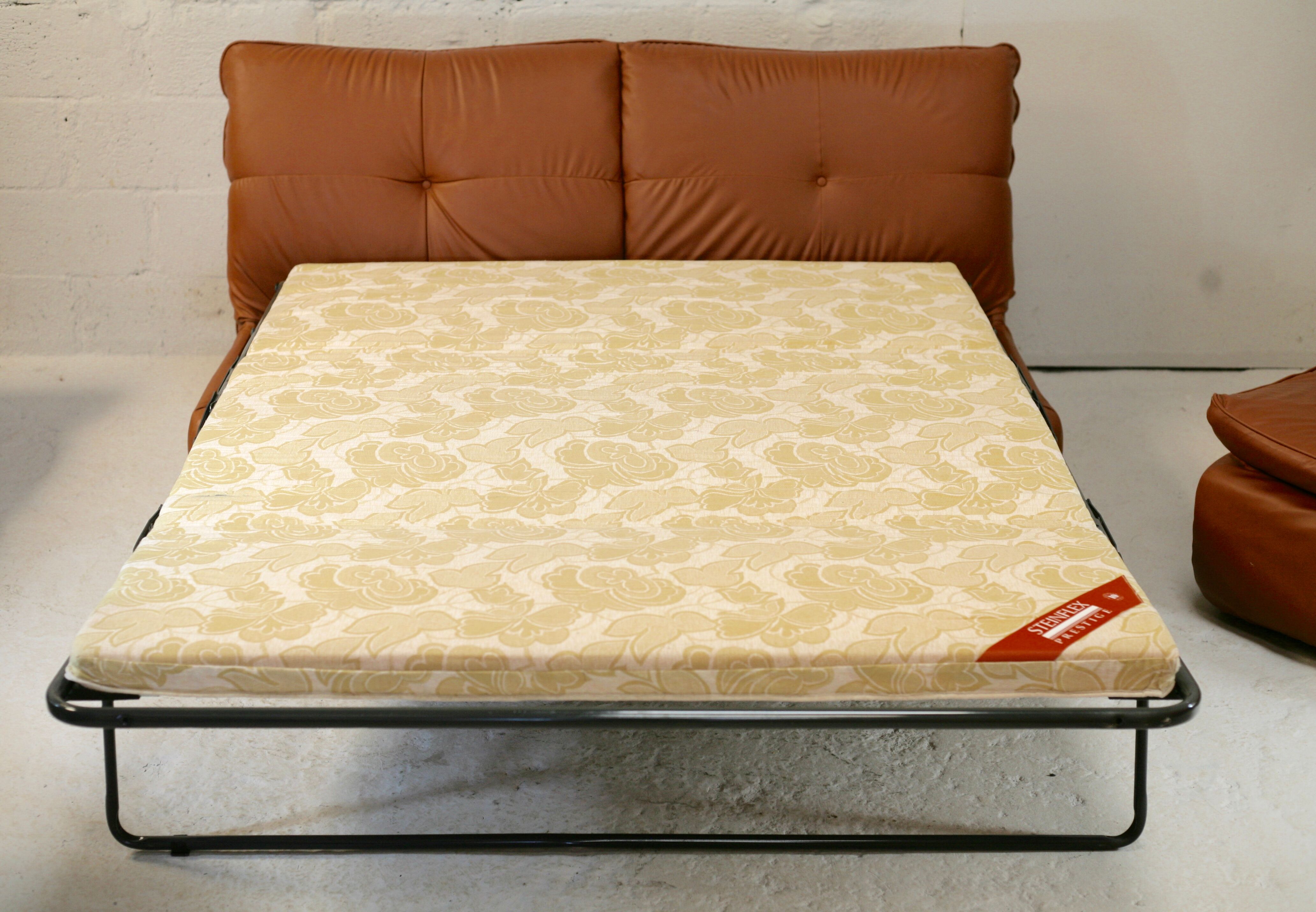 Imitation leather sofa "caramel". Convertible. France, circa 1990