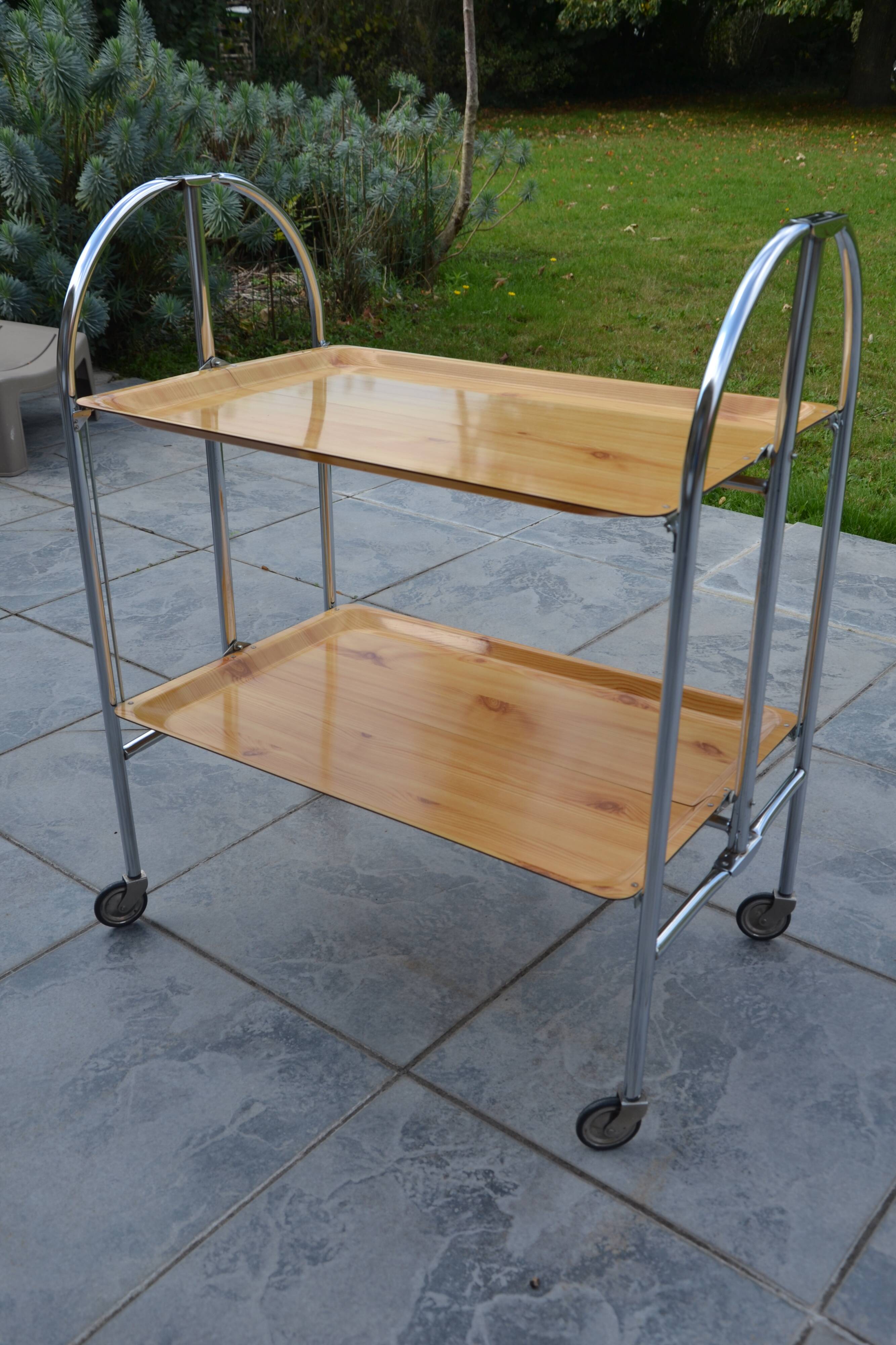 Folding dessert trolley on chrome metal wheels and formica.