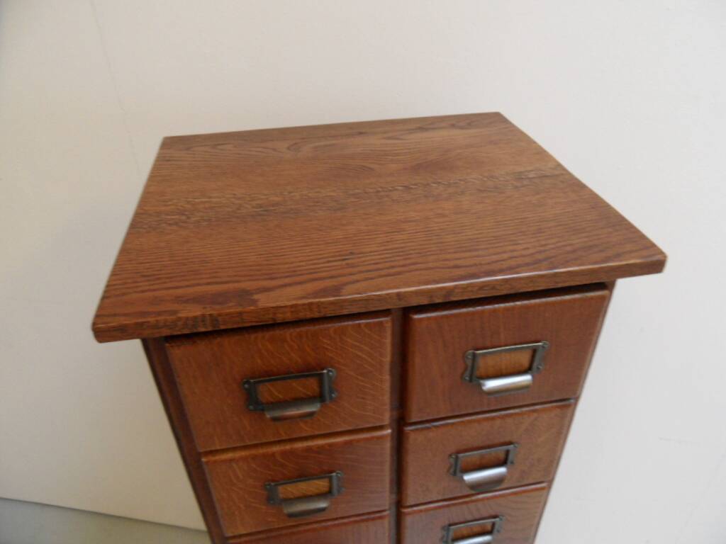 Antique oak apothecary cabinet with drawers