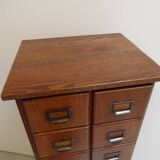 Antique oak apothecary cabinet with drawers