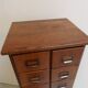 Antique oak apothecary cabinet with drawers