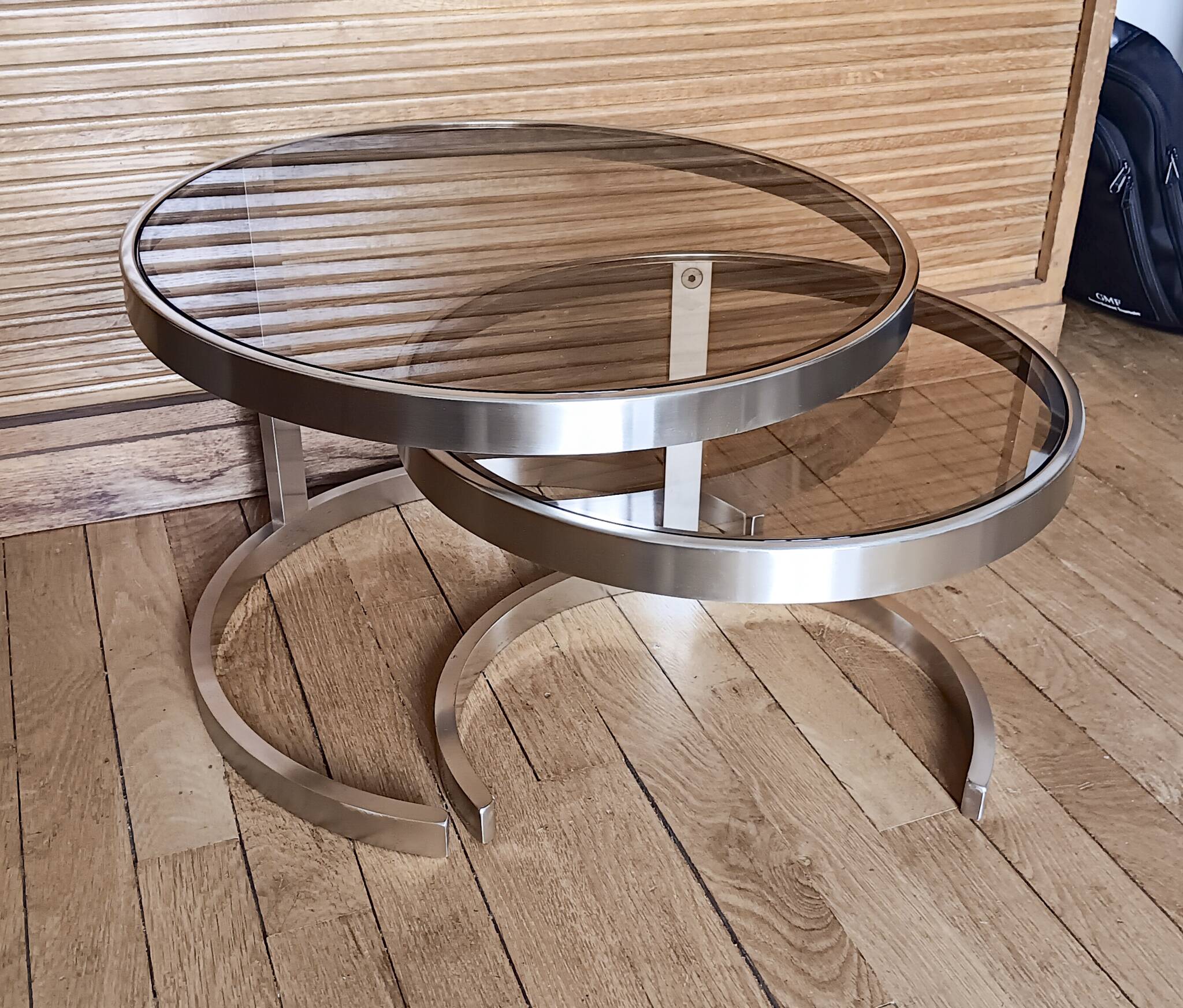 2 vintage 1970s smoked glass and brushed metal nesting coffee tables