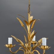 Golden suspension on ears of wheat, circa 1960