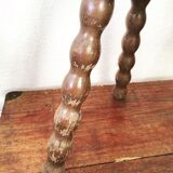 Turned wooden milking stool