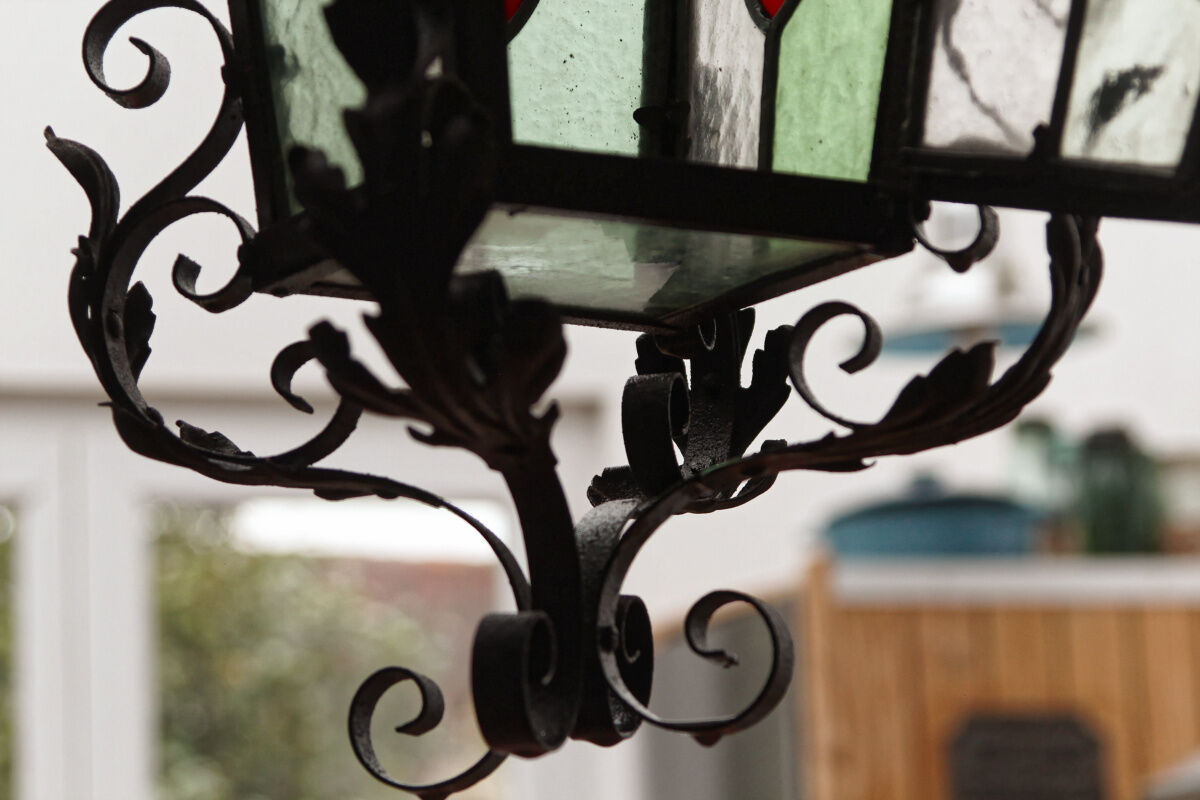 Wrought iron lantern and stained glass windows