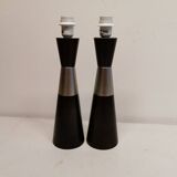 Two table lamps made of dark-stained wood with silver detail in the middle.