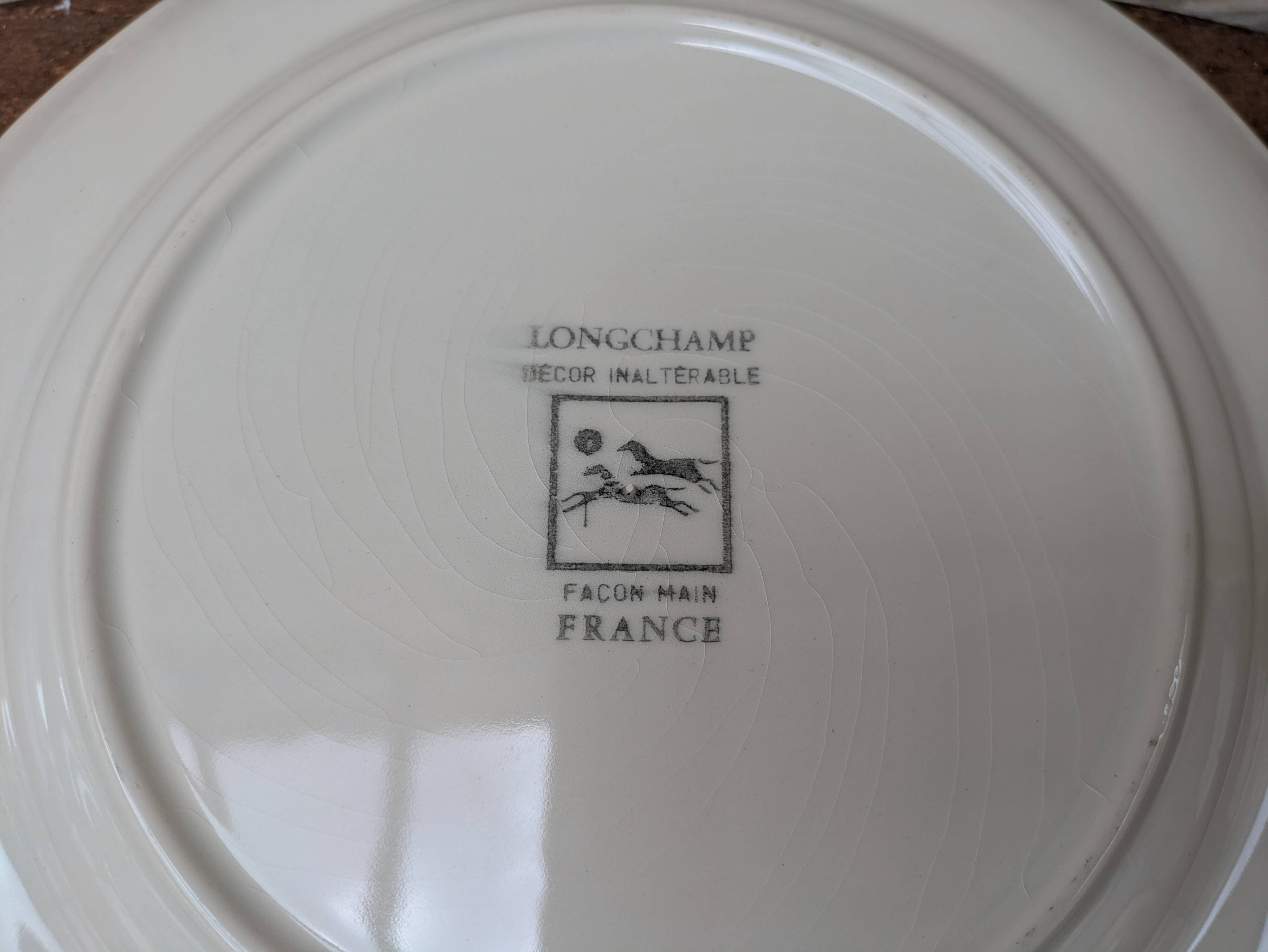 Vintage Longchamp plate handmade with bird and flower decoration, 25.5cm.