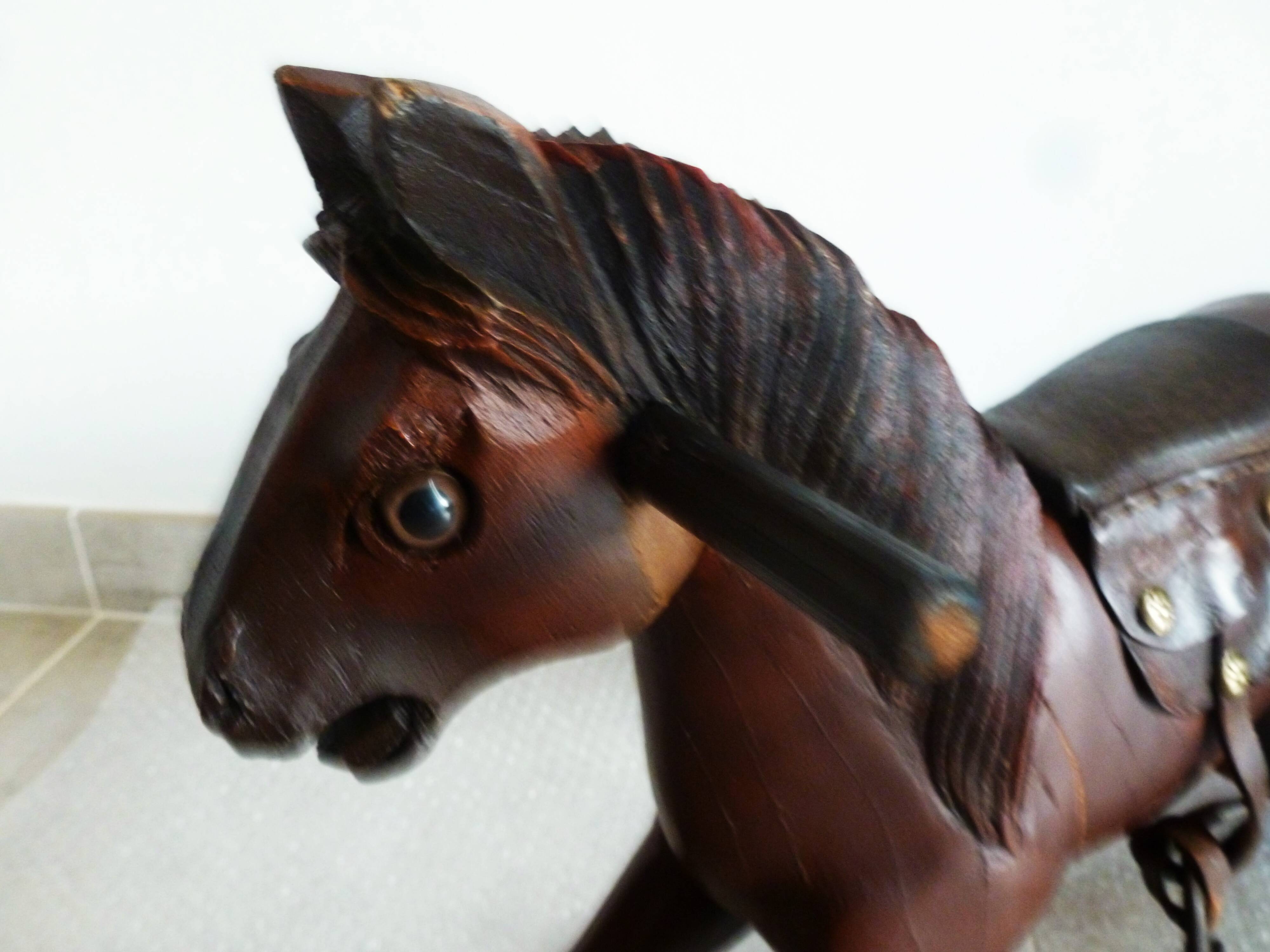 Antique wooden and leather rocking horse