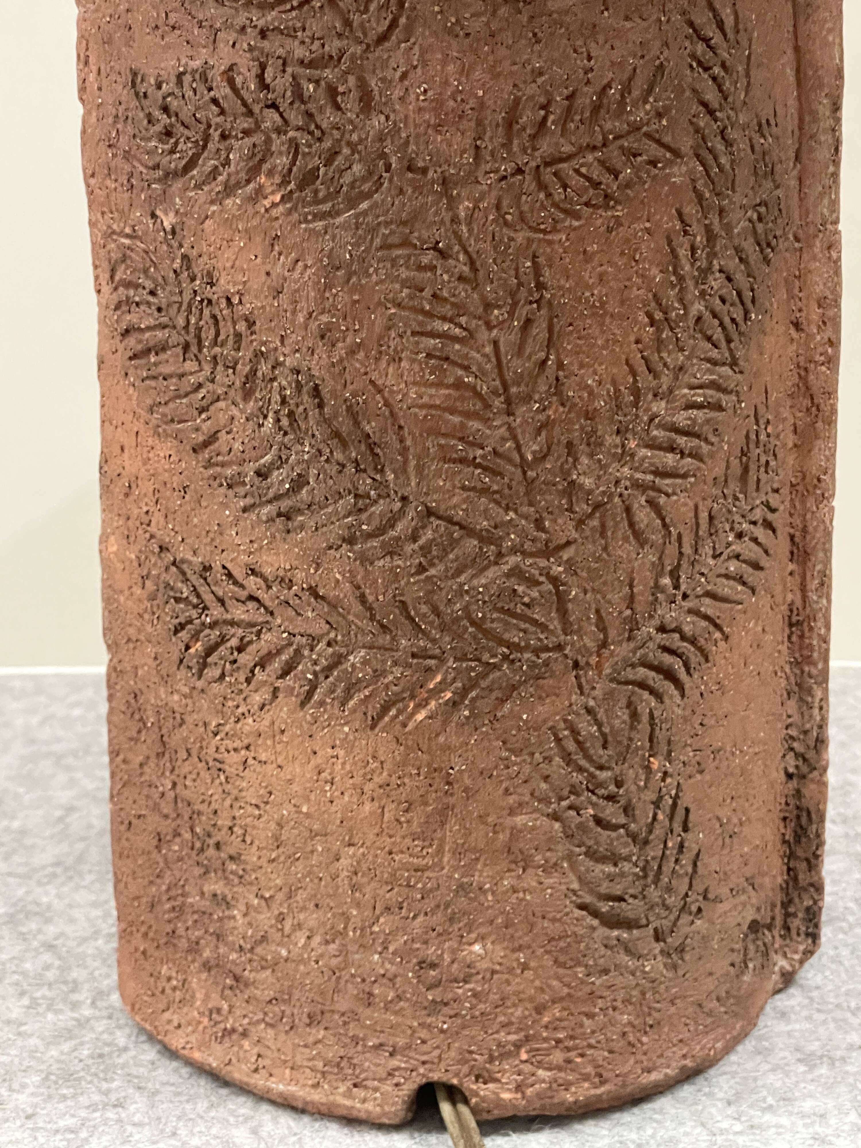 Large chamotte clay lamp in brutalist style, with a plant motif.