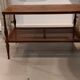 Coffee table / side table in mahogany with a rattan shelf.