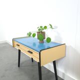 Jaren 50 ladekastje met blauw blad en zwarte poten
