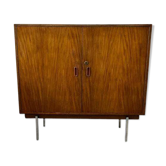 Vintage wooden chest of drawers on steel legs