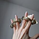 2 golden leaf curtain clips