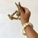 Double coat hook in Hollywood Regency style, brass swan