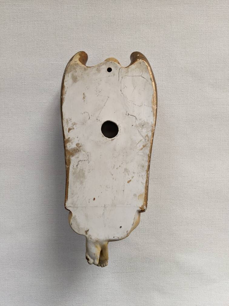 Antique ceramic holy water font with winged angel, religious object, country decoration