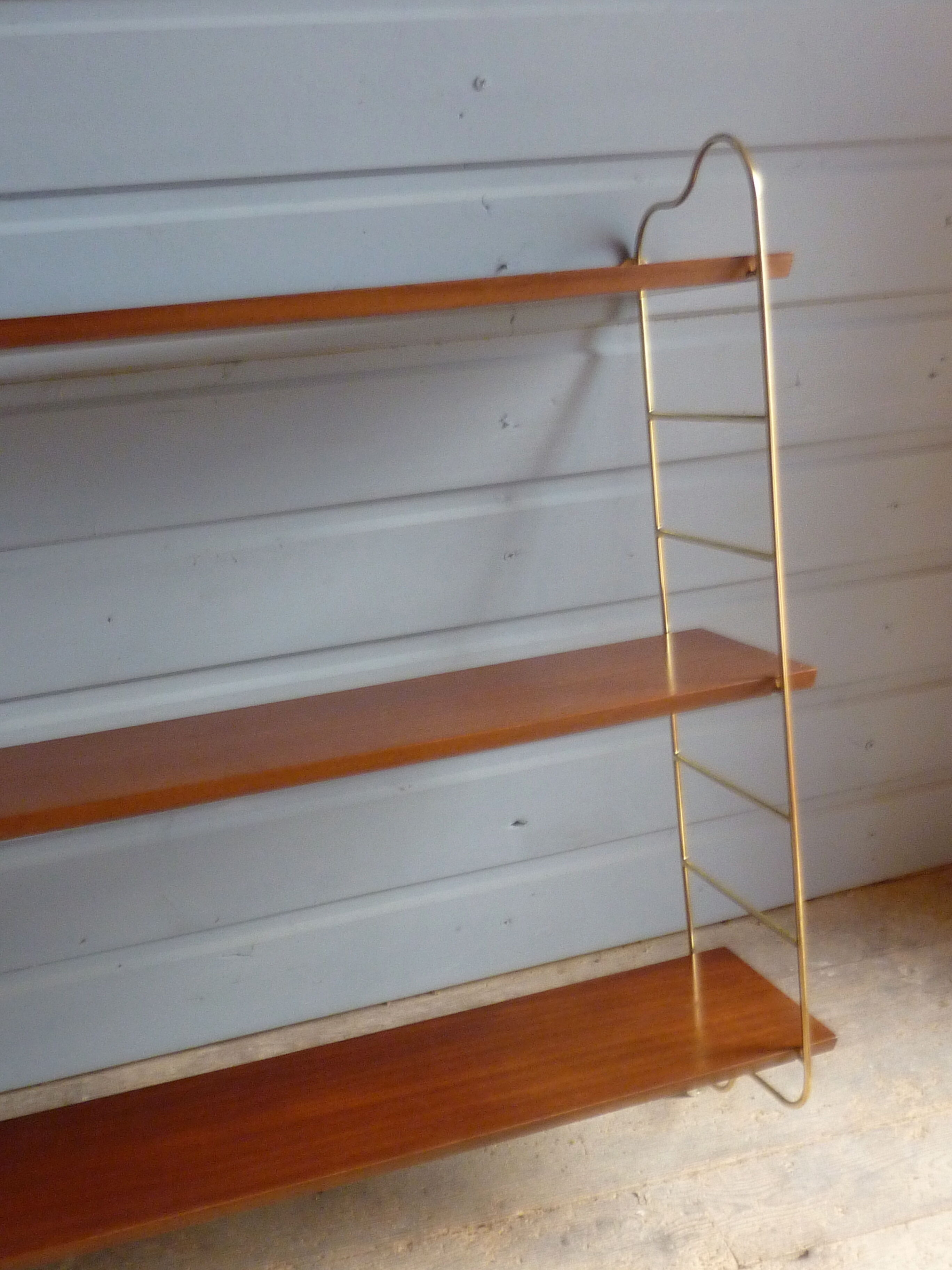 Wall shelves in brass and teak of the 1960s