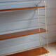 Wall shelves in brass and teak of the 1960s