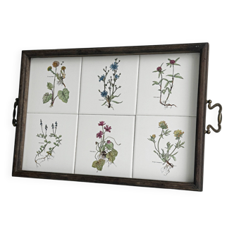 Old wooden plateau with floral tiles