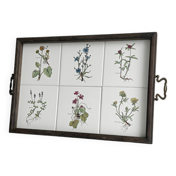Old wooden plateau with floral tiles