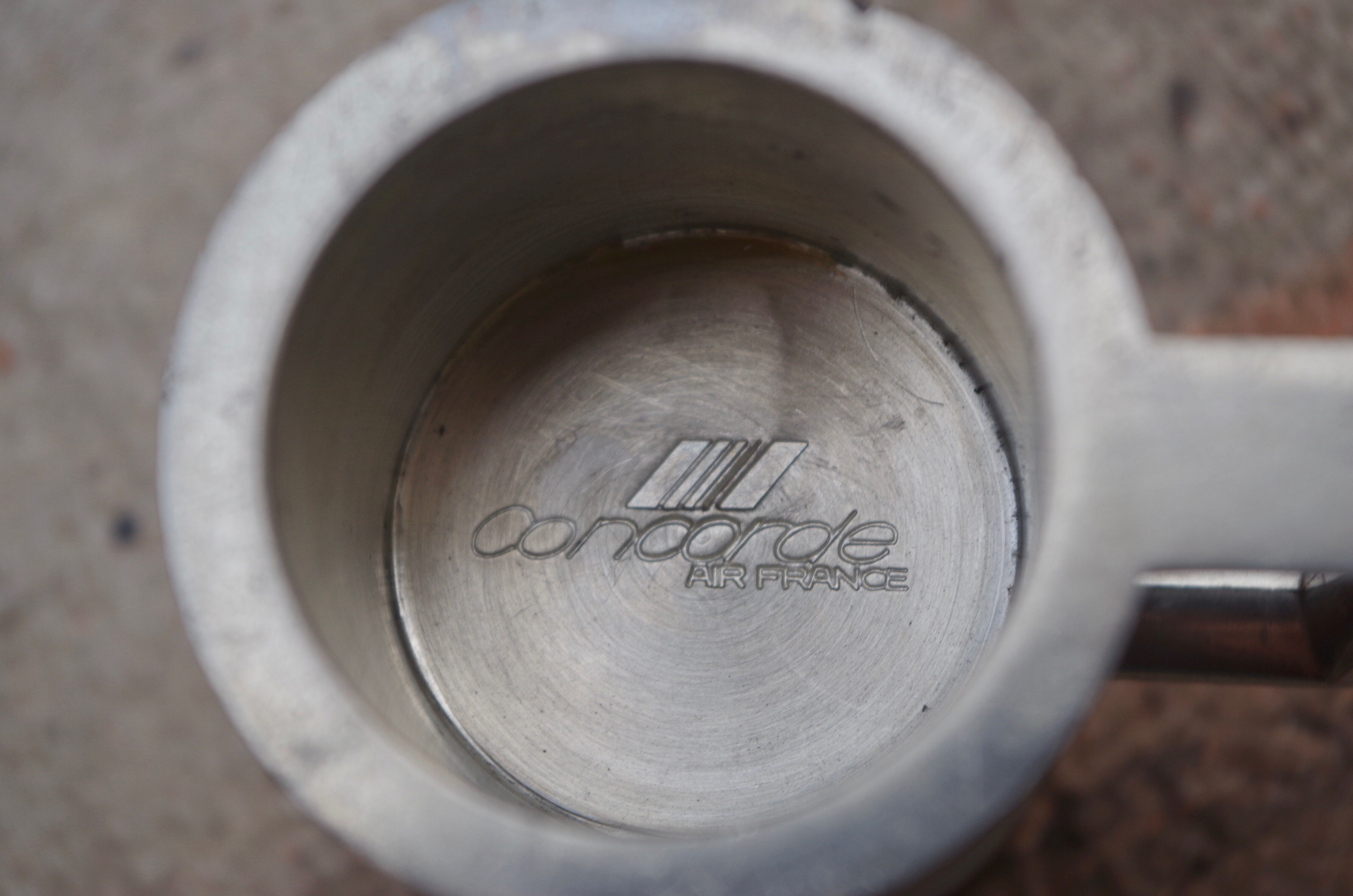 Concorde branded pewter whiskey jigger