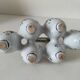 Antique egg holder by Jules Verlingue with polychrome floral decoration.