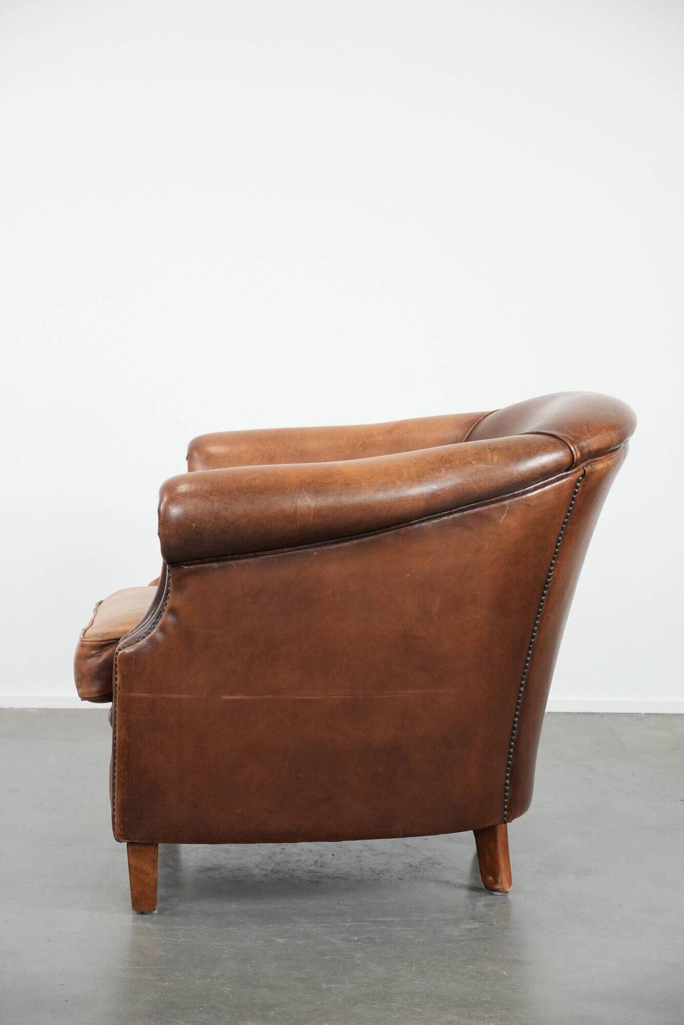 Comfortable club chair made of sheepskin leather