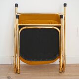 2 Vintage Eyrel folding chairs in mustard yellow and gold – Chic retro design