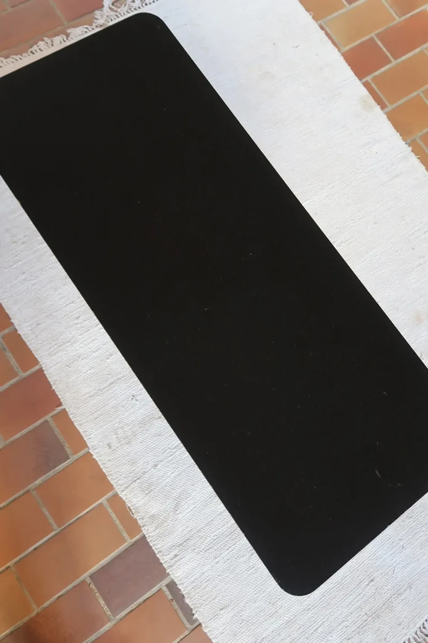70s design coffee table with a black top and steel legs.