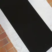 70s design coffee table with a black top and steel legs.