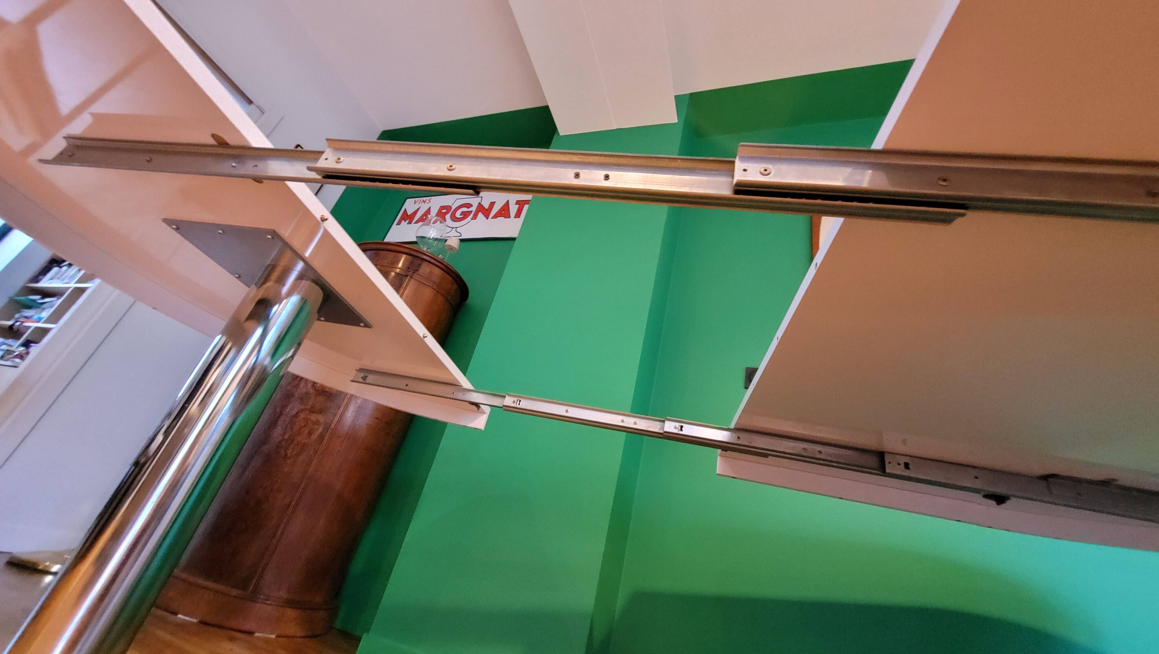 Ligne Roset table in glossy white lacquer, chrome legs, 2 extensions.