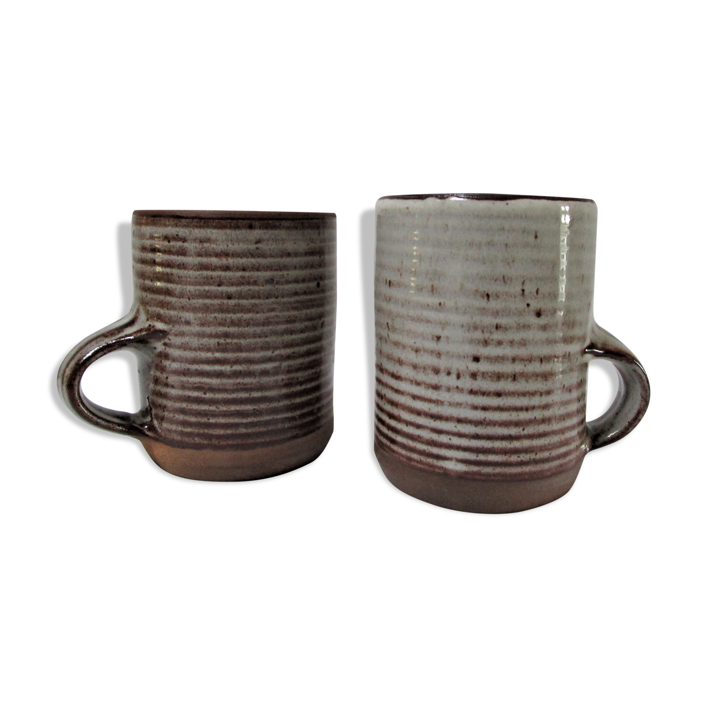 Two enamelled sandstone mugs Roger Jacques handwritten signature