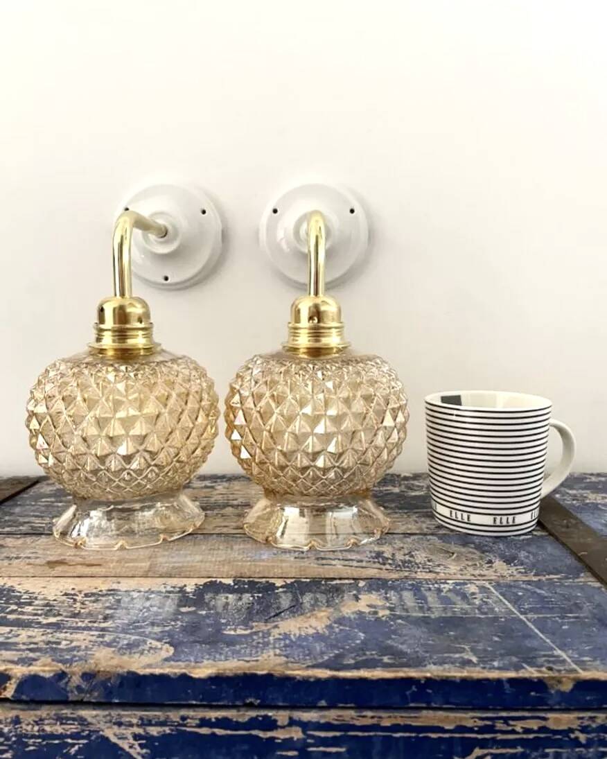 Pair of golden globe wall lights
