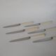 set of 6 small white bakelite knives 1960