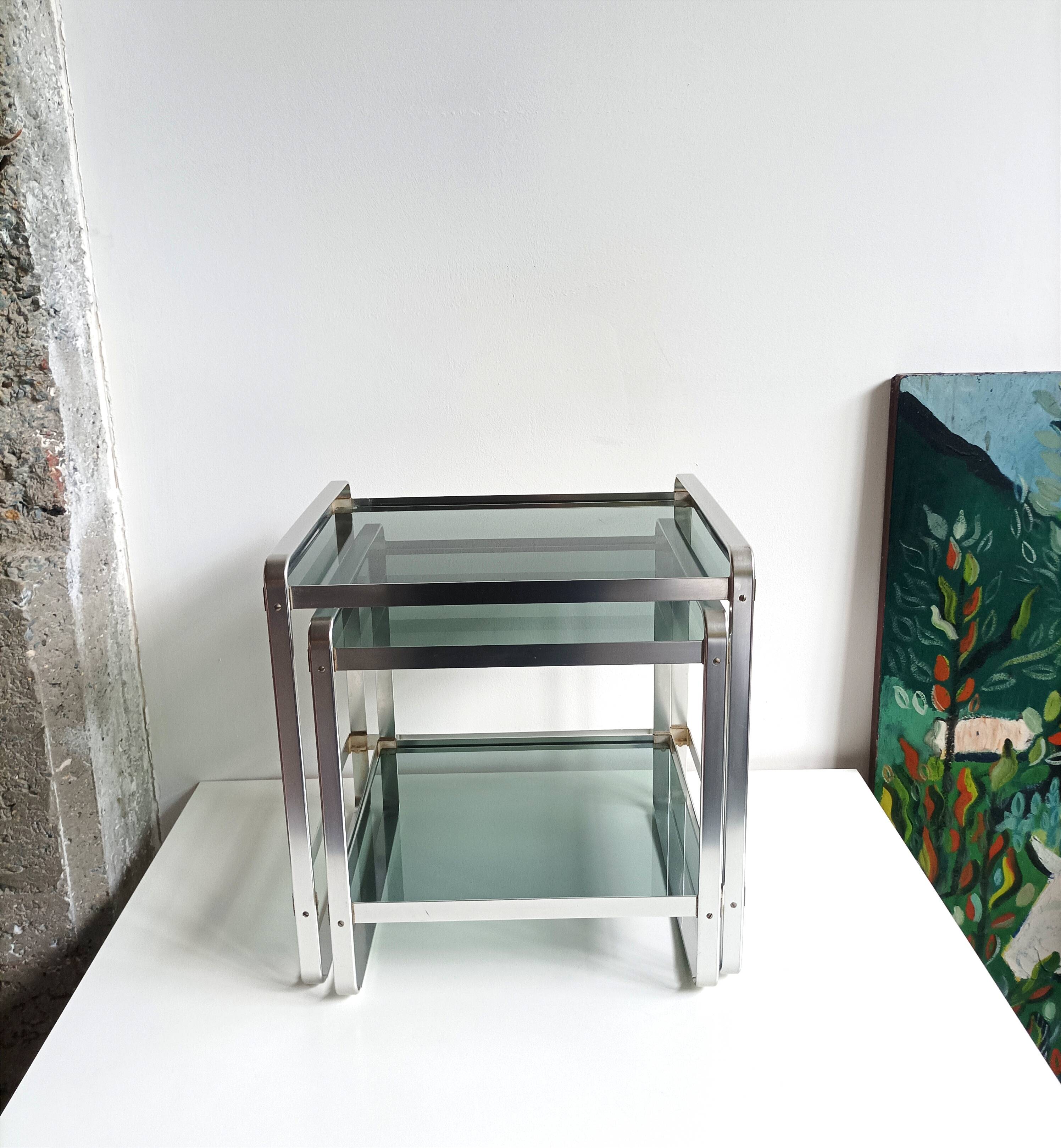 Nested tables in aluminium and smoked glass by Martini & Rossi, 1970s.