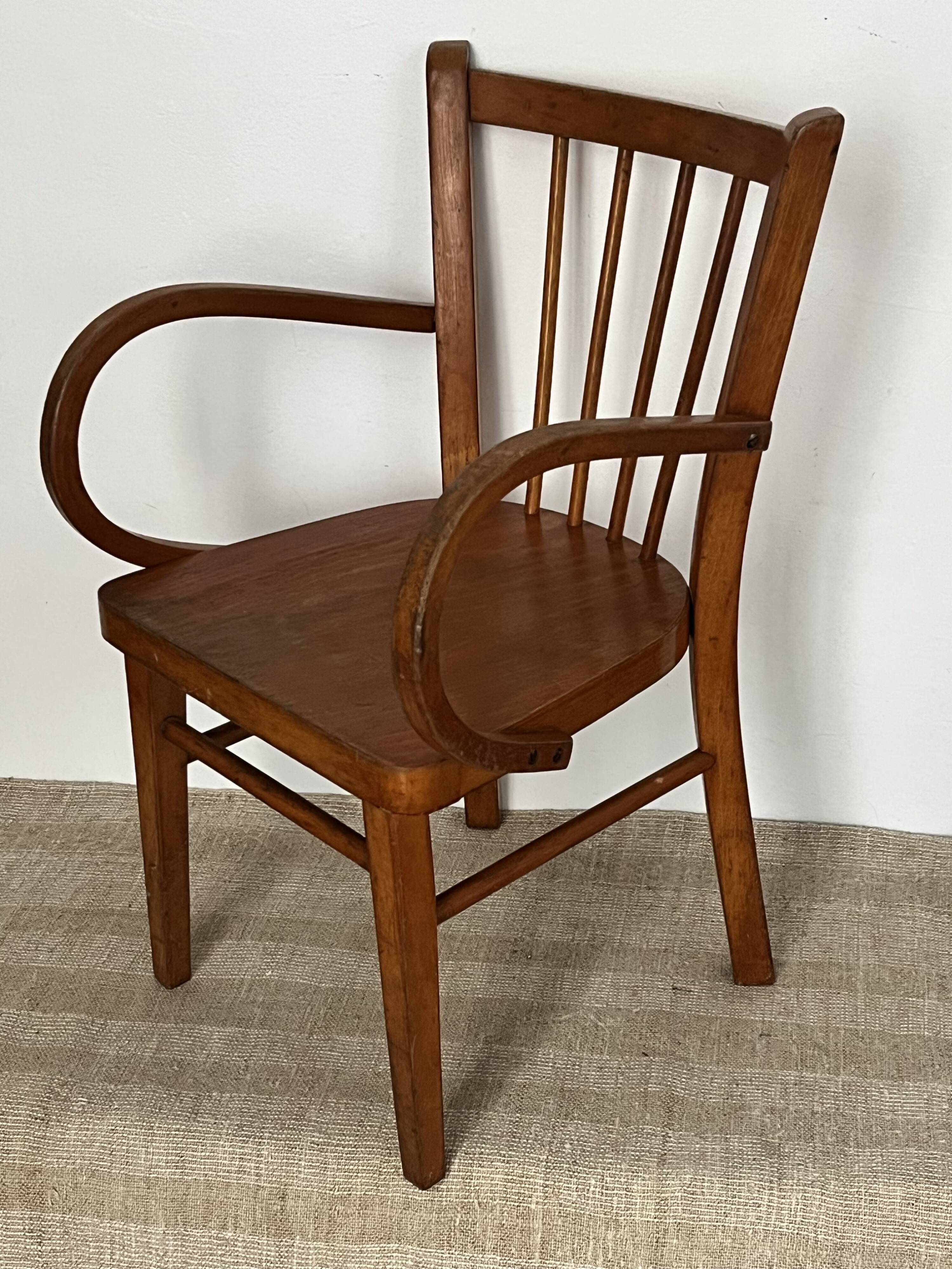 Curved wooden child's armchair - early 20th century