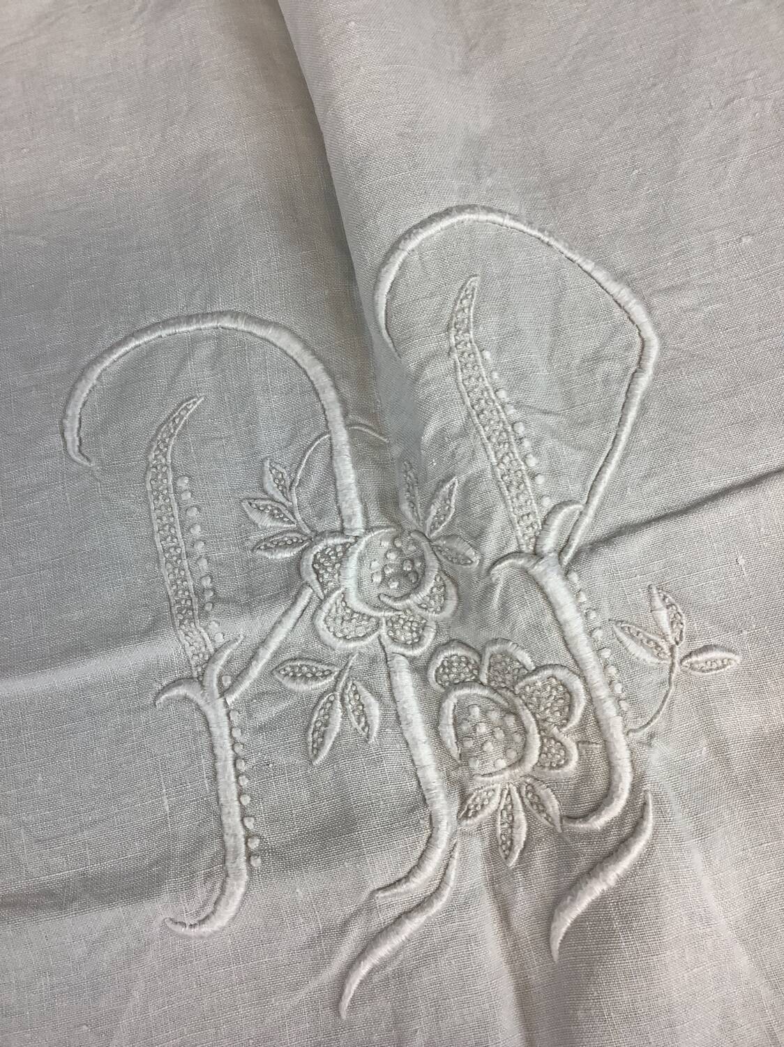 Old linen sheet with monogram embroidery