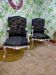 Black Louis XV style armchairs