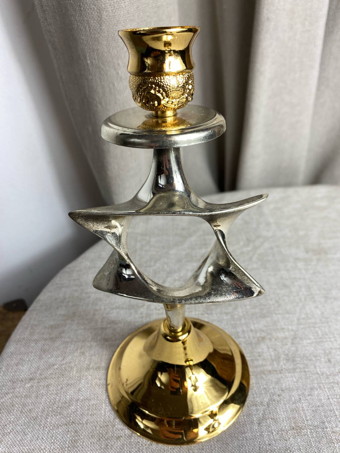 Pair of silver and gold metal candlesticks