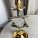 Pair of silver and gold metal candlesticks