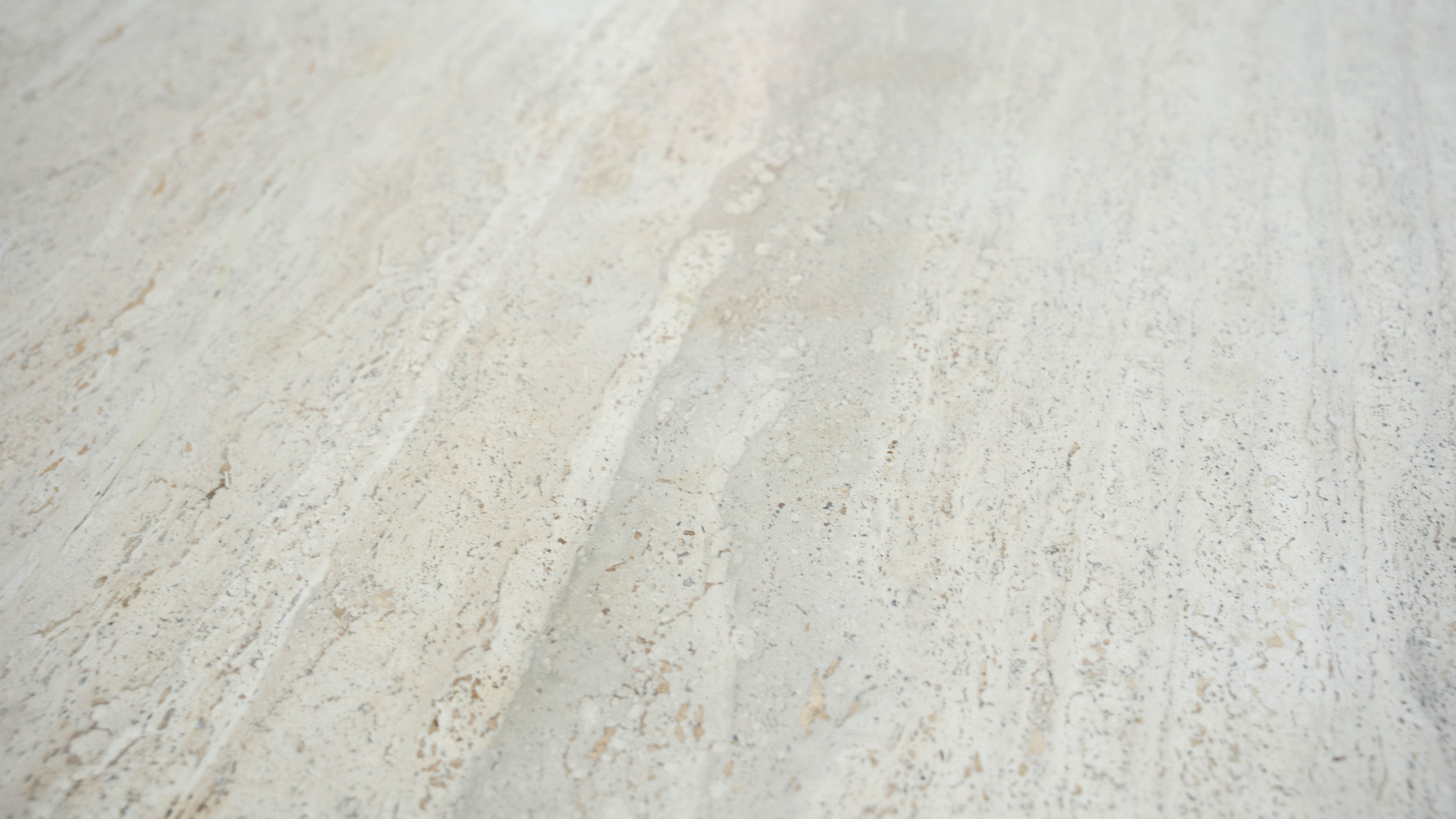 Round Belgian travertine dining table