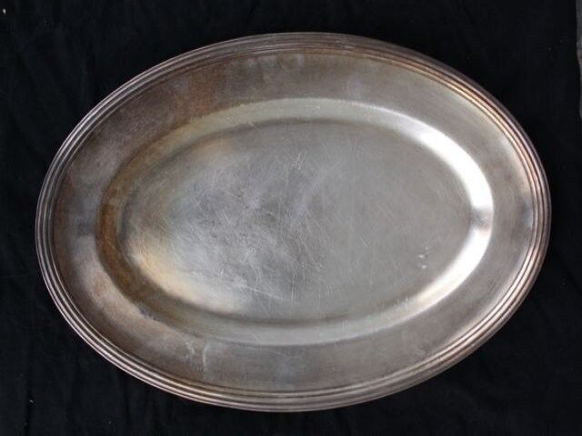 Flat oval silver metal