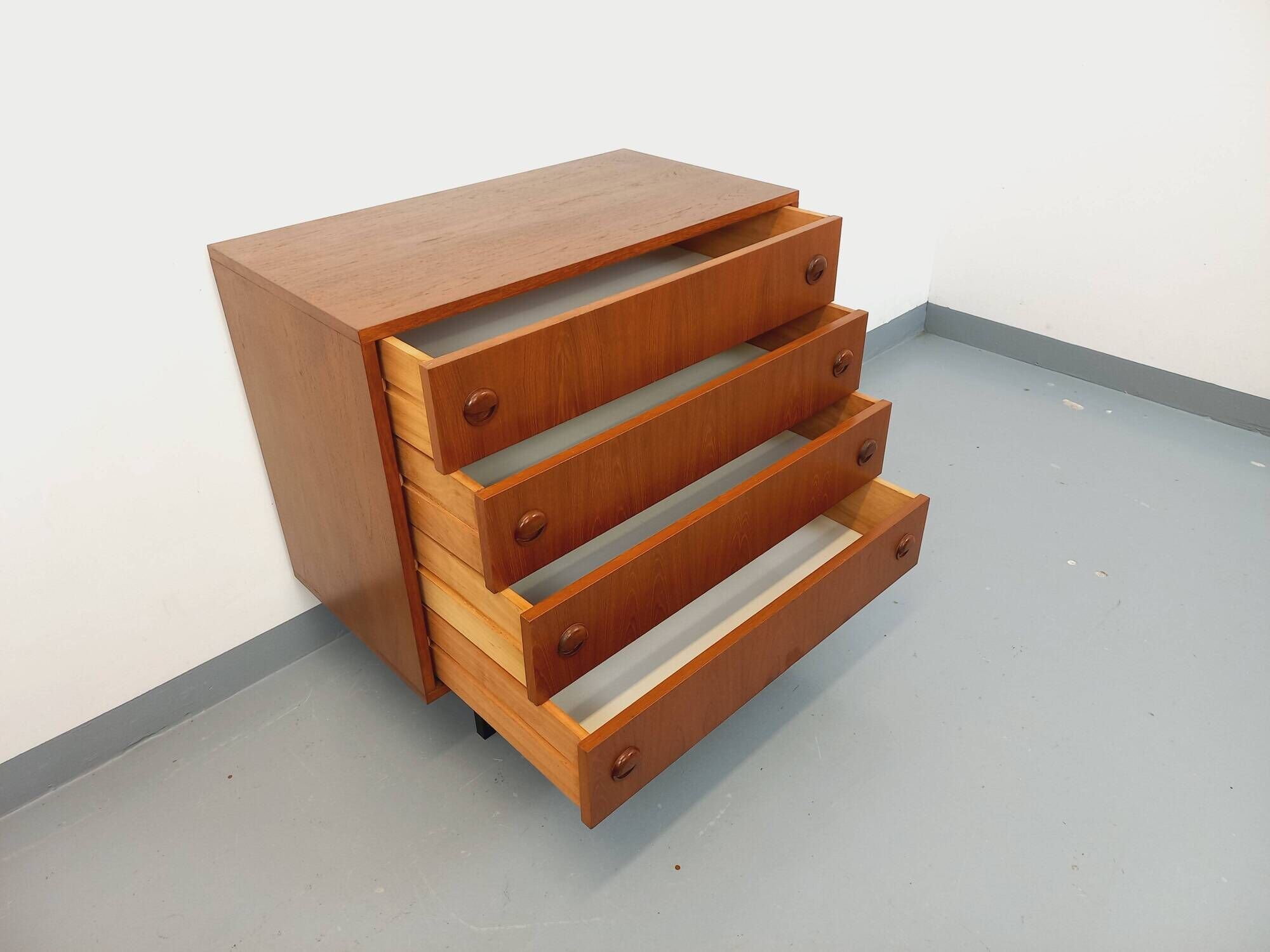 Vintage Scandinavian style chest of drawers in teak and black metal from the 60s