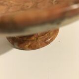 Empty pocket on foot in red marble