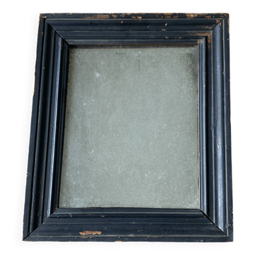 19th-century blackened mirror with speckled glass, 34cm x 40cm.