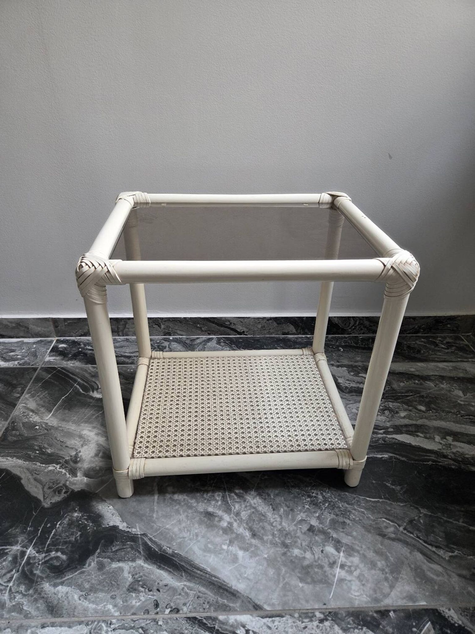 Rattan and cane side table with tinted glass top