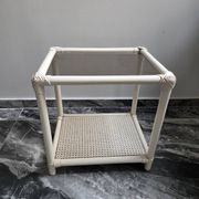 Rattan and cane side table with tinted glass top